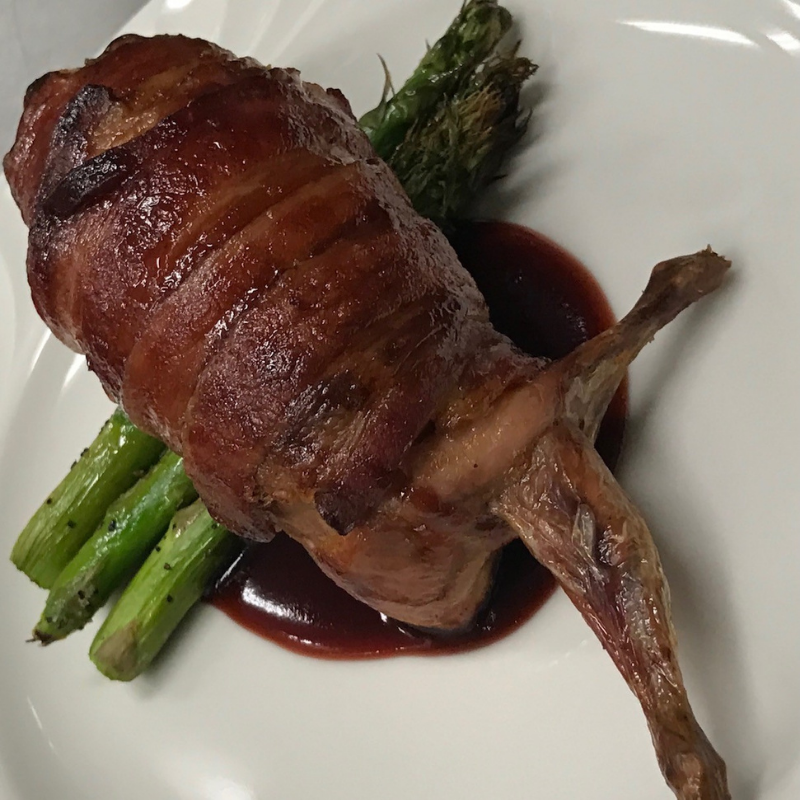 Bacon-Wrapped Quail with Pomegranate and Cranberry Molasses Reduction